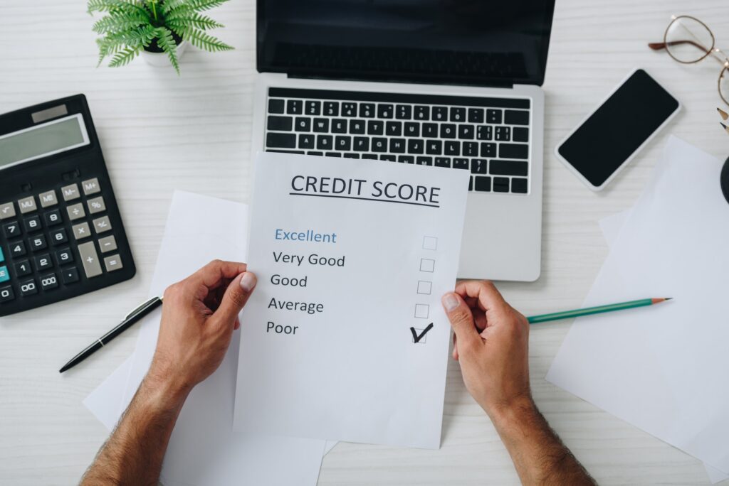 top view of young adult man holding credit score