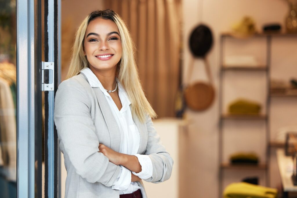 So happy with my store. Shot of a young female business owner in her store.